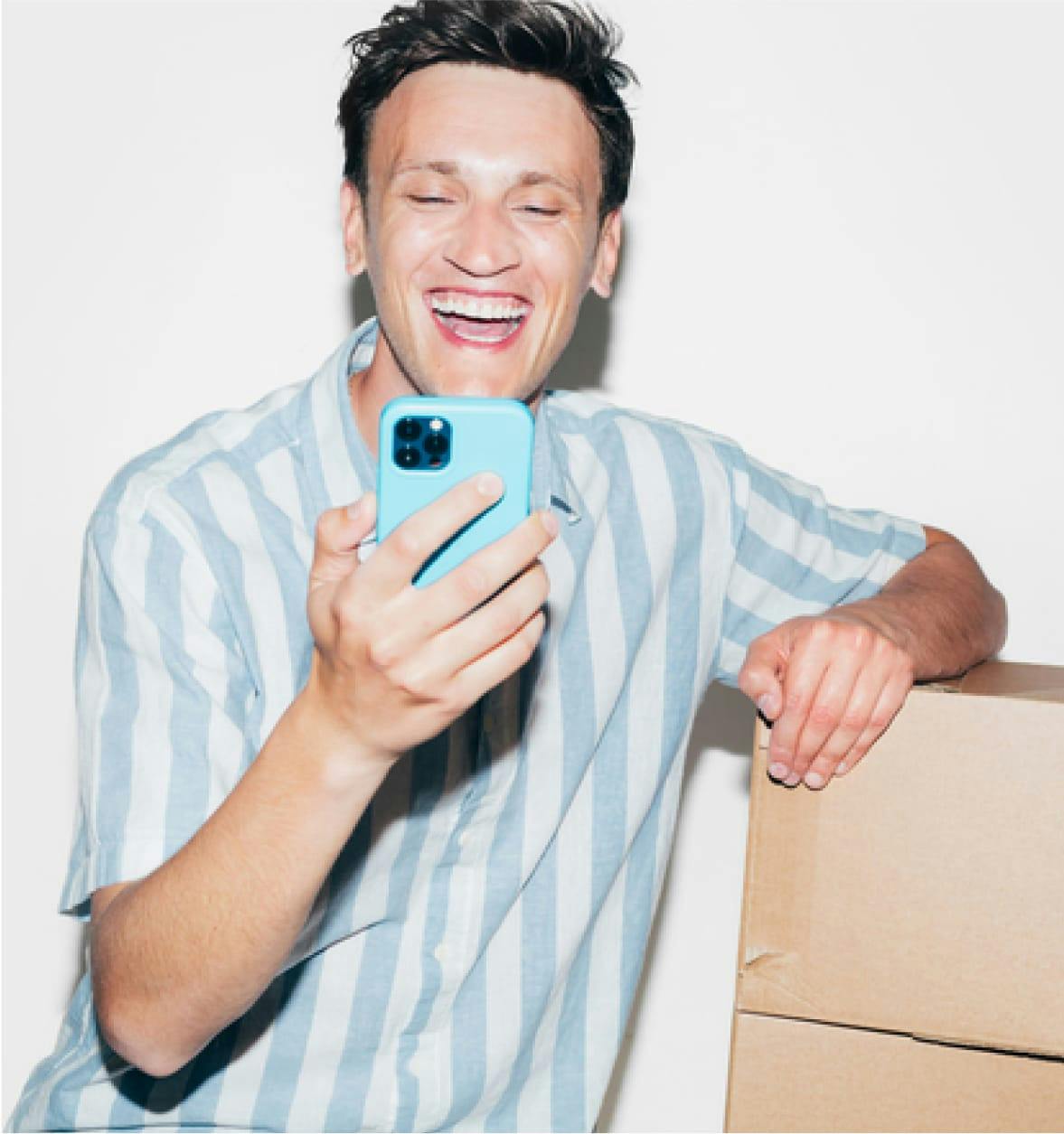 Unibuddy sample student message overlayed on image of laughing man wearing blue striped shirt on blue phone